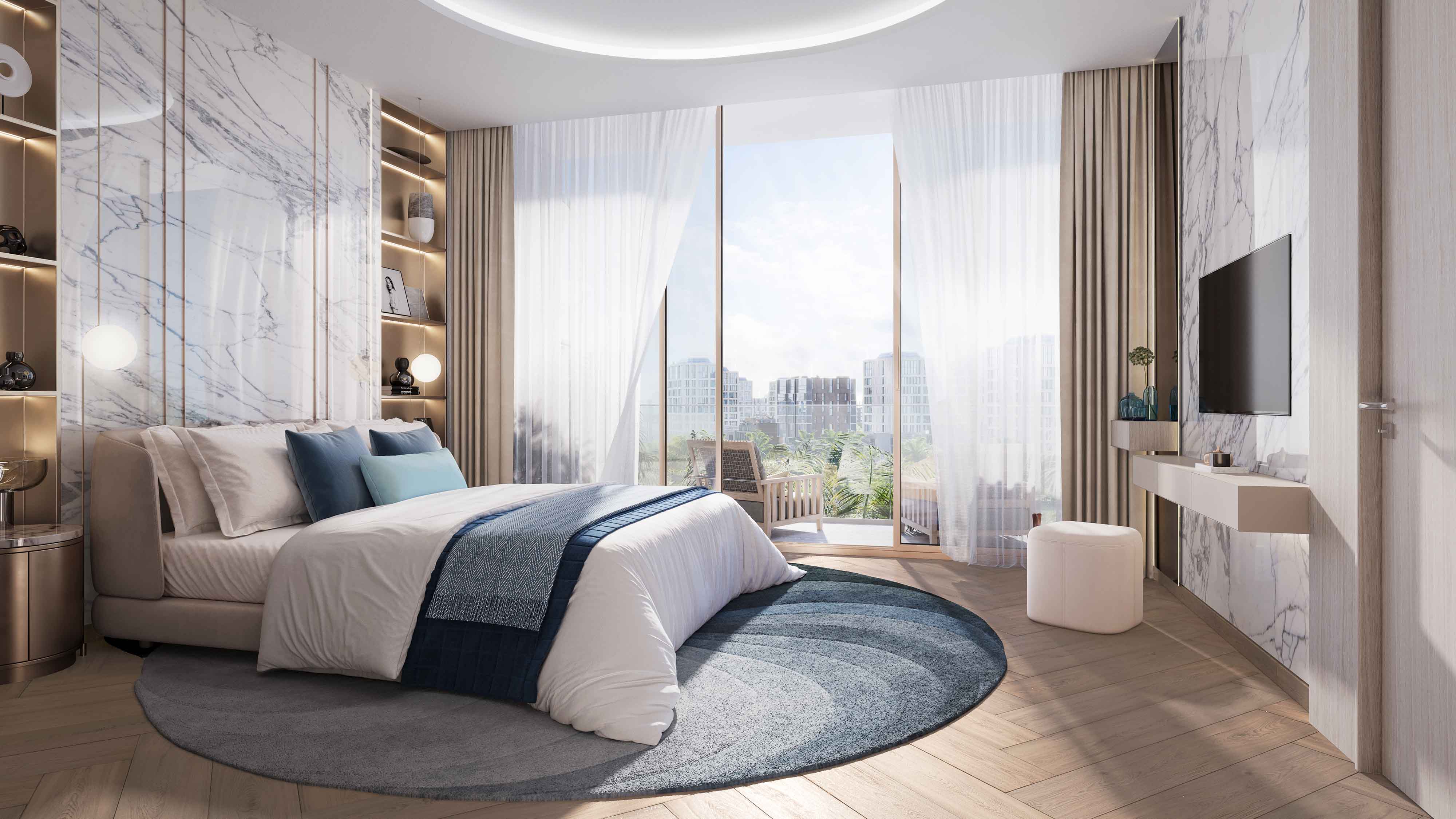 Beach Walk Residence A modern bedroom featuring a plush bed, marble accent wall, large windows, and stylish decor elements.